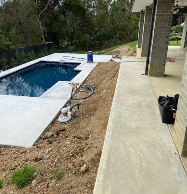 Pebble mix paving around pool by Express Floors Mornington