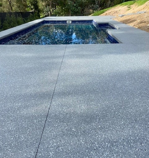 Pool area nonslip pebble mix coating by Express Floors Mornington Peninsula